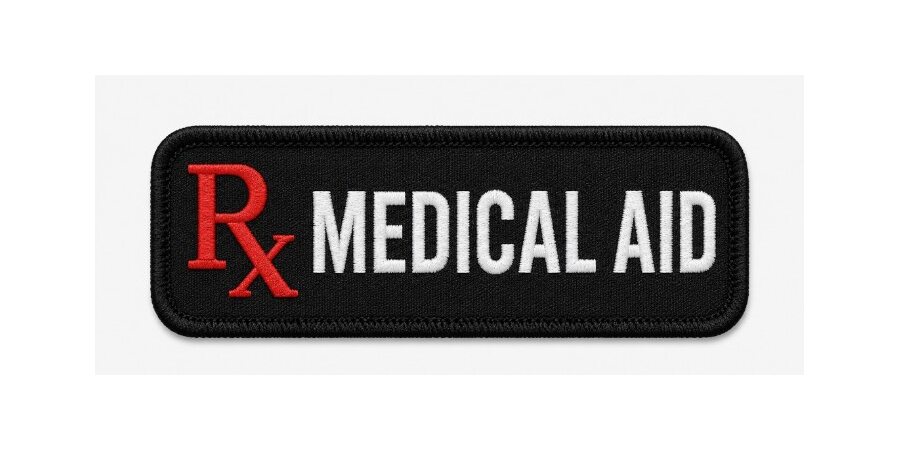 Black embroidered badge reading RX Medical Aid